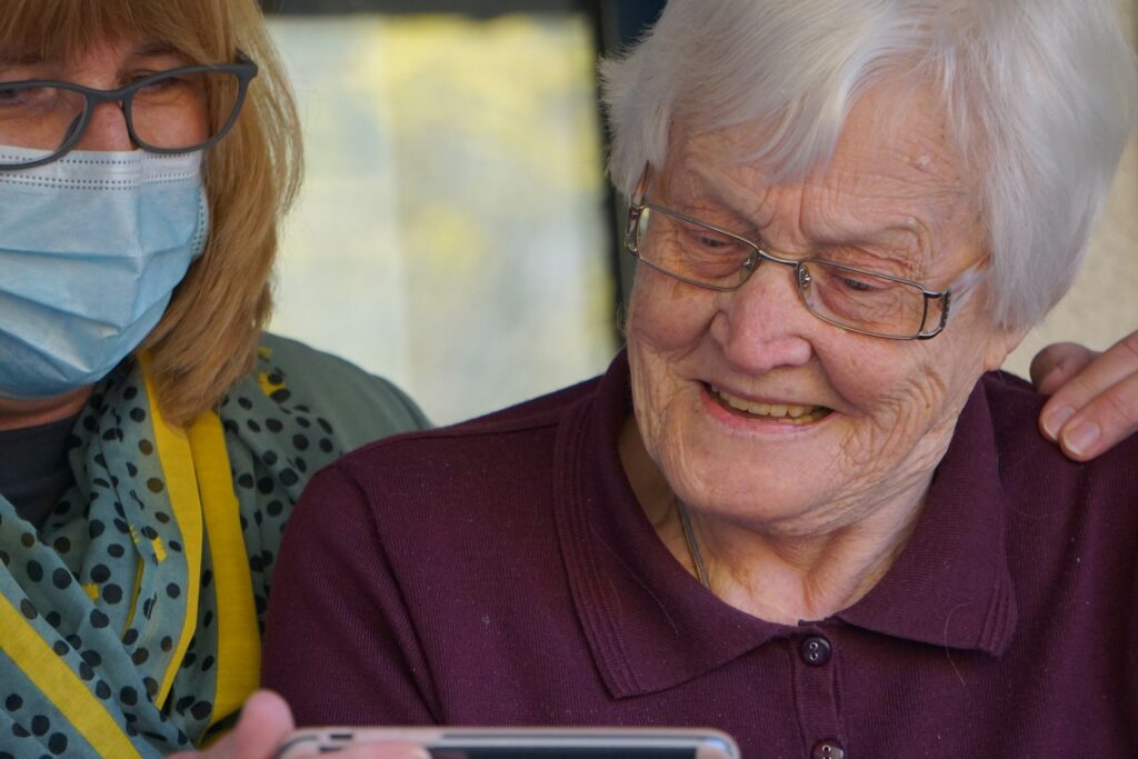 Professional caregiver checking in on a home health client